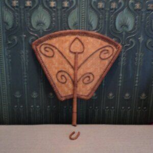 vintage wicker fan wall decor